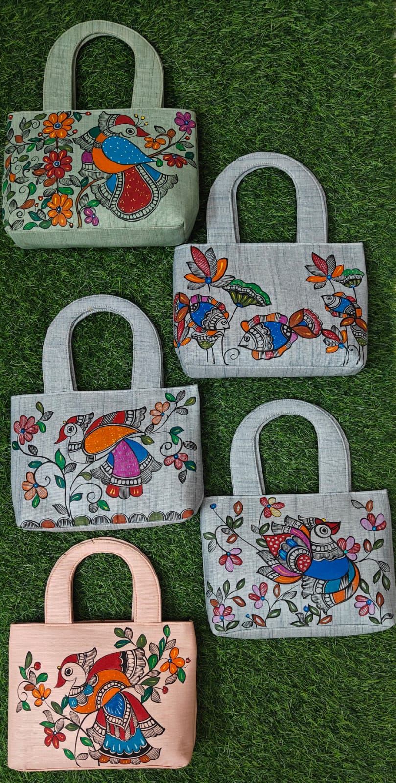 Collection of khadi cotton purses with bird, fish and floral Madhubani paintings