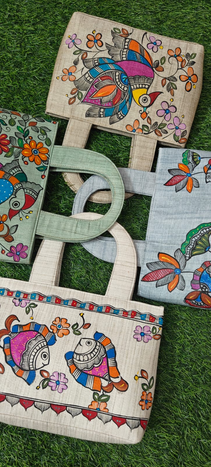 Mint and cream khadi cotton purses with Madhubani bird, fish and lotus artwork
