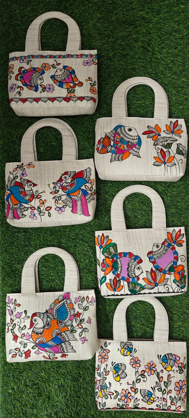 Variety of khadi cotton hand-painted purses with fish, bird and butterfly Madhubani motifs