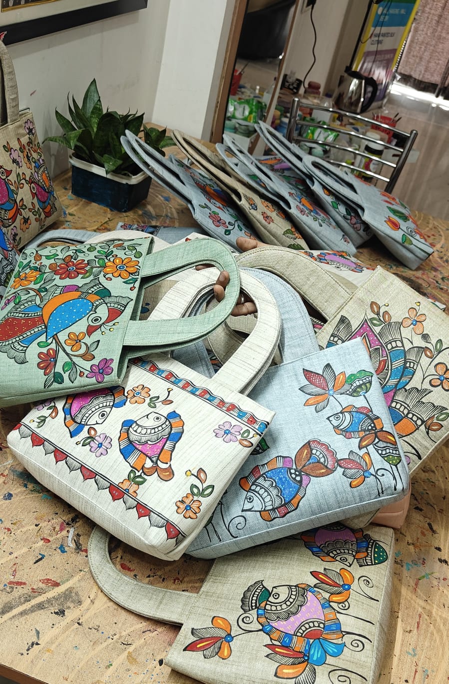 Workshop view of finished Madhubani painted khadi cotton purses